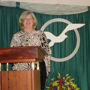 Cathy at the podium